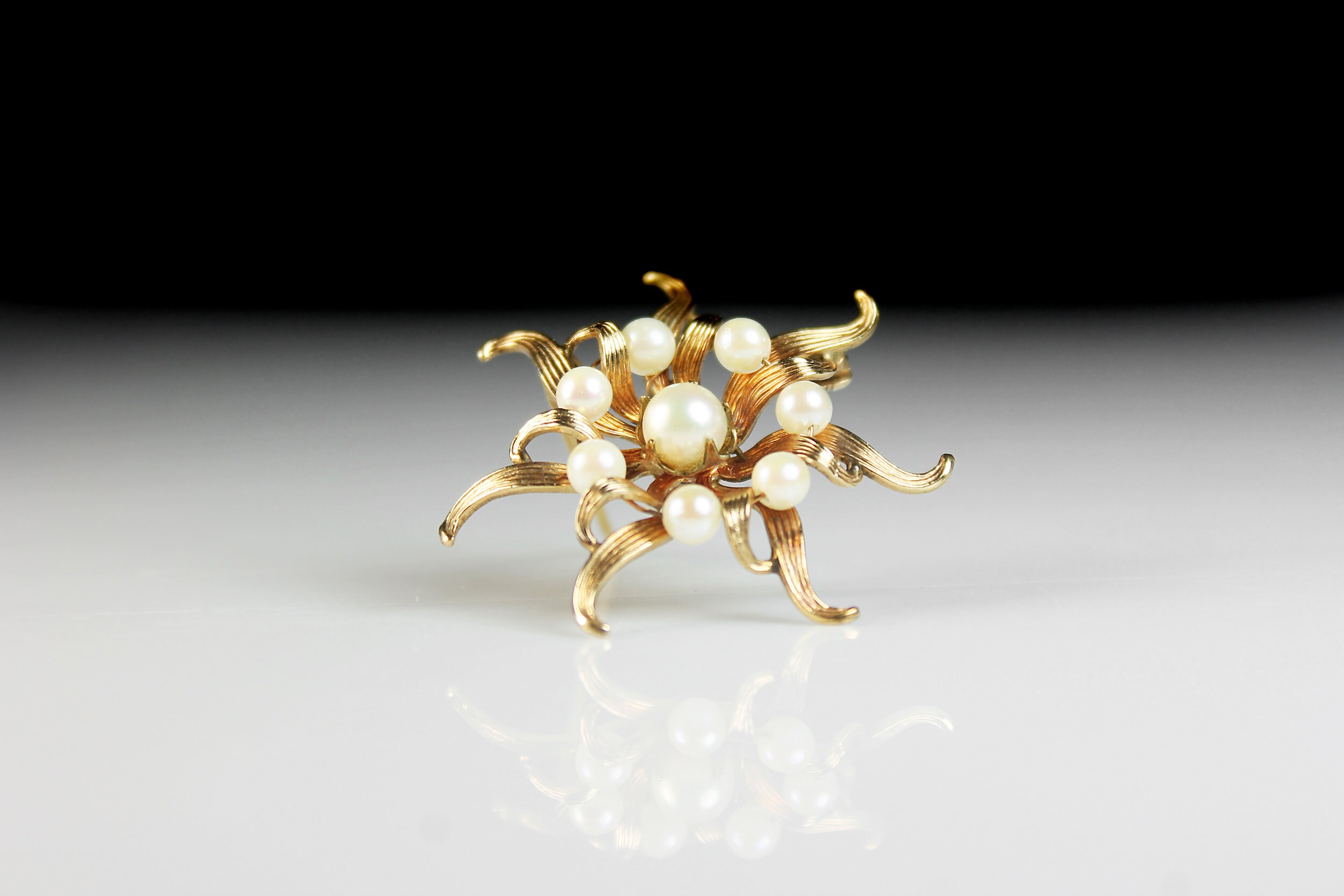 gold lv brooch