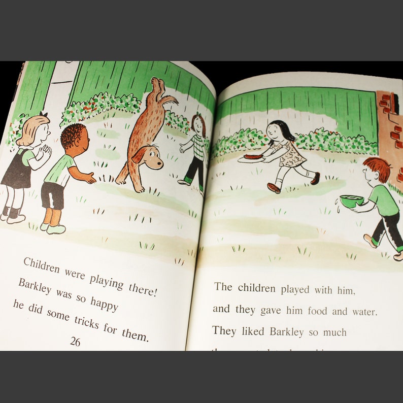 May include: A children's book illustration showing a group of children playing with a brown dog. The dog is doing a handstand. The children are smiling and laughing. The text on the page reads: "Children were playing there! Barkley was so happy he did some tricks for them."