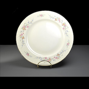 May include: A set of three ceramic mugs with a speckled, matte finish. The mugs are in shades of cream, light gray, and dark gray. Each mug has a simple, modern design and a rounded handle.