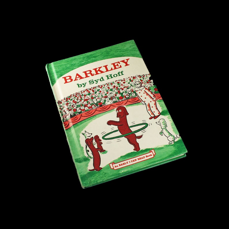 May include: A green book titled "Barkley by Syd Hoff" with a red dog jumping through a hoop. The book is part of the "As Easily I Can Read Book" series.