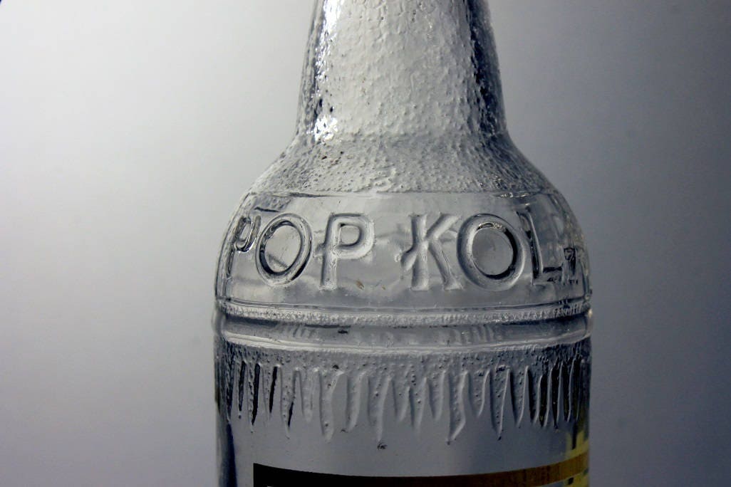 Pop Kola NY, 12 ounces, Embossed, Pryo Glazed, Glass, Soda Bottle