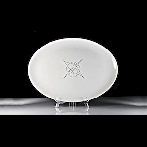 May include: White oval serving platter with a black abstract design in the center.
