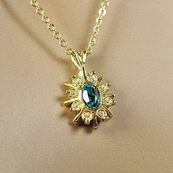 Avon Starburst Pendant Necklace with Faux Blue Topaz & Clear Rhinestones, Gold-Tone Jewelry