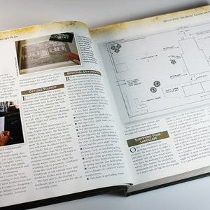 May include: An open book with the title "Developing the Right Landscape Plan" on the cover. The book features a detailed illustration of a house and surrounding landscape, with text discussing assessing your existing landscape and surveying your landscape.