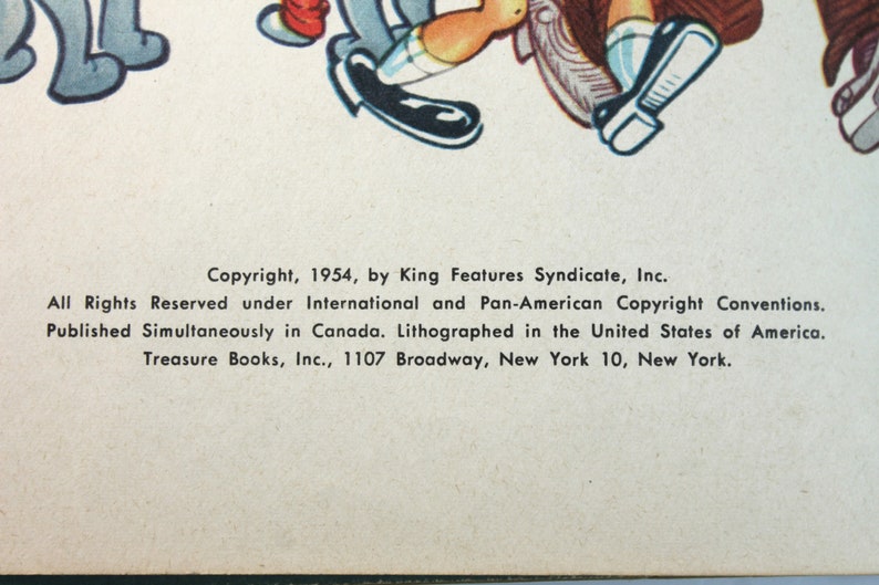 May include: Copyright information for a book published in 1954 by King Features Syndicate, Inc. The book was published simultaneously in Canada and lithographed in the United States of America. The publisher is Treasure Books, Inc., located at 1107 Broadway, New York 10, New York.