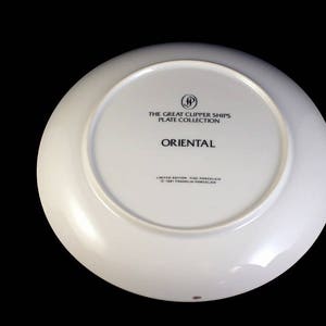 May include: White porcelain plate from "The Great Clipper Ships Plate Collection." The plate's underside features the word "ORIENTAL" in black text, along with other text and a logo. The plate is a limited edition.