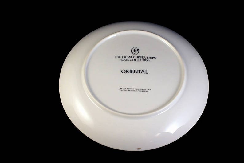 May include: White porcelain plate from "The Great Clipper Ships Plate Collection." The plate's underside features the word "ORIENTAL" in black text, along with other text and a logo. The plate is a limited edition.