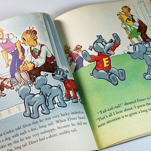 May include: An illustration from a children's book showing a dog with a short tail and a group of dogs with long tails. The text reads "Tail-tail-tail!" shouted Elmer to his friends in the yard. "That's all I hear about. I guess the only way for me to get some attention is to grow a long tail."