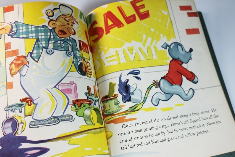 May include: An illustration of a man painting a sign with a paintbrush. The sign says "SALE" and "PAINT". A blue dog with a red shirt and a long tail is running away from the man. The dog's tail is dragging through a puddle of blue paint.