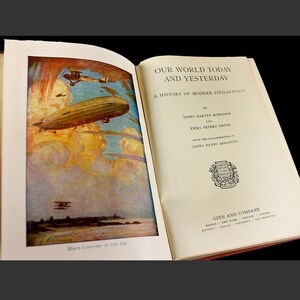 May include: An open book with a colourful illustration of an airship and aeroplanes flying in the sky. The book title is "Our World Today and Yesterday: A History of Modern Civilization" by James Harvey Robinson and Emma Peters Smith, with the collaboration of James Henry Breasted. The book is published by Ginn and Company.
