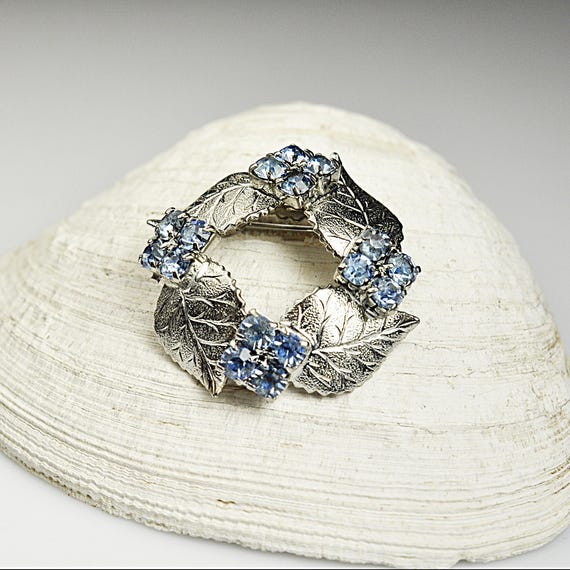 Silver Tone Leaf Wreath Brooch with Blue Rhinestones – Circular Pin – Mid-Century Costume Jewelry