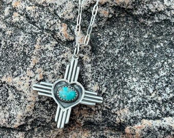 Large New Mexico Zia symbol heart oval pendant.
