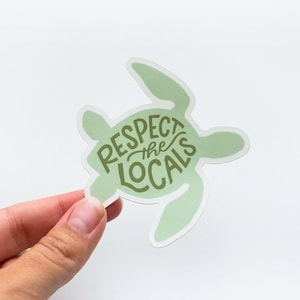 May include: Green sea turtle sticker with the text "Respect the Locals" in brown lettering.