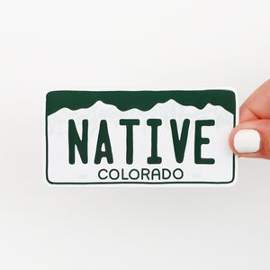 May include: White sticker with green mountain silhouette and the text "NATIVE COLORADO" in black.