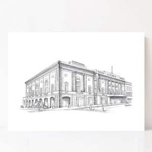 May include: A black and white pen and ink drawing of a building, with the word "LEADER" on the top. The building features arched windows and a detailed facade. The artwork is set against a white background.
