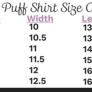 May include: A Girls Puff Shirt Size Chart with size, width, and length measurements. Sizes range from 12 months to 5T. Widths range from 10 inches to 12.5 inches. Lengths range from 13 inches to 16.5 inches. The chart is in black and white.
