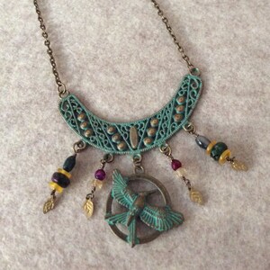 Wire wrapped beads and hummingbird charm with zola element pendant on brass chain