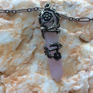 Fancy wire wrapped rose quartz pendant on brass chain