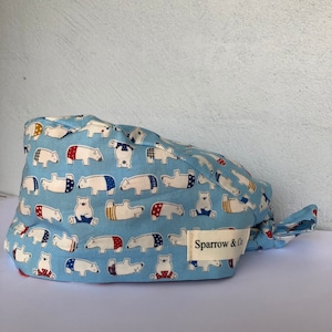 Scrub cap tie back style, Sloths, wombats, sweet floral with birds and butterflies. manyfabric options .  100 % cotton.