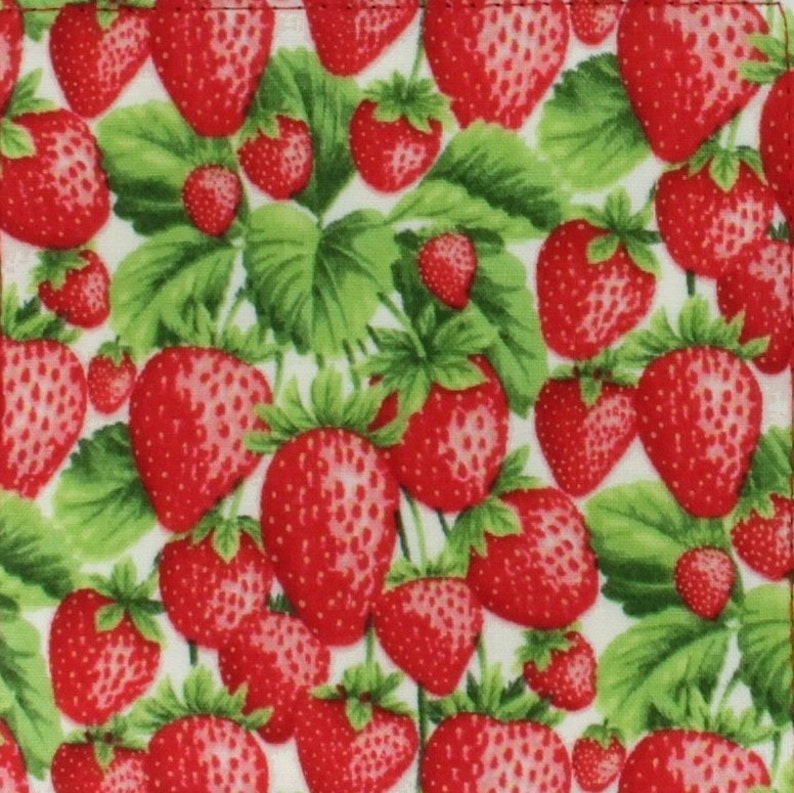 May include: A white background with a repeating pattern of red strawberries and green leaves.