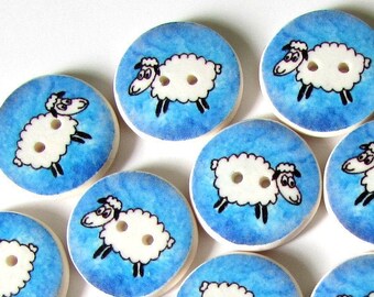 May include: A set of 15 wooden buttons with a blue and white watercolor background. Each button features a black and white illustration of a sheep with two white buttons.