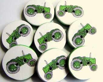 May include: Eight green and white wooden buttons with a green tractor design. The tractors are all facing the same direction and have a white background.