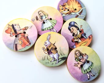 May include: A set of six round wooden buttons featuring colorful illustrations from Alice in Wonderland, including the Queen of Hearts, Alice, the Cheshire Cat, the Mad Hatter, the White Rabbit, and Alice holding a piglet, each with two holes.