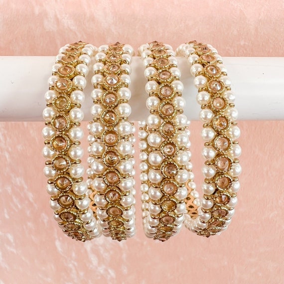 Pearl bangles on sale in gold