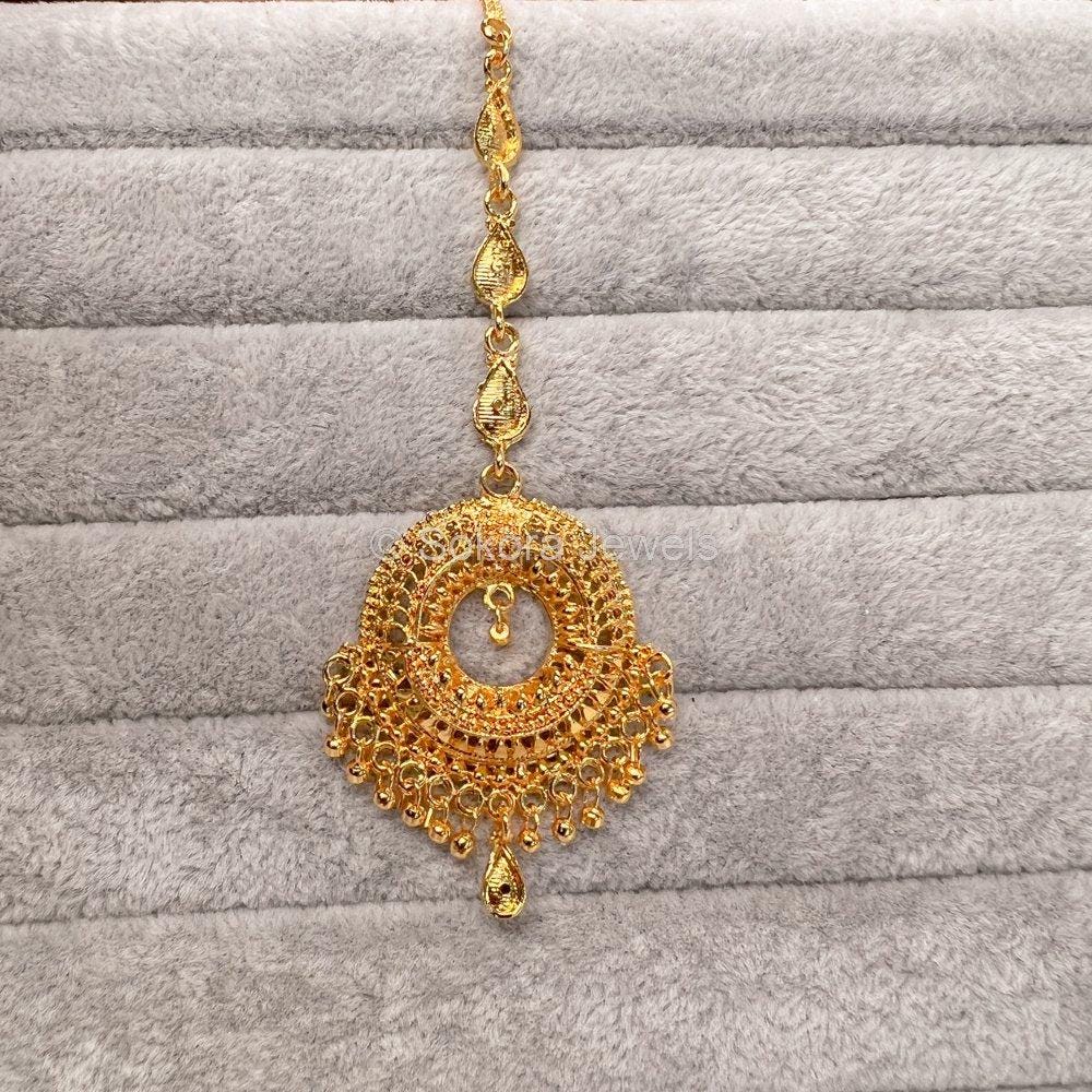 Golden colour maang tikka top