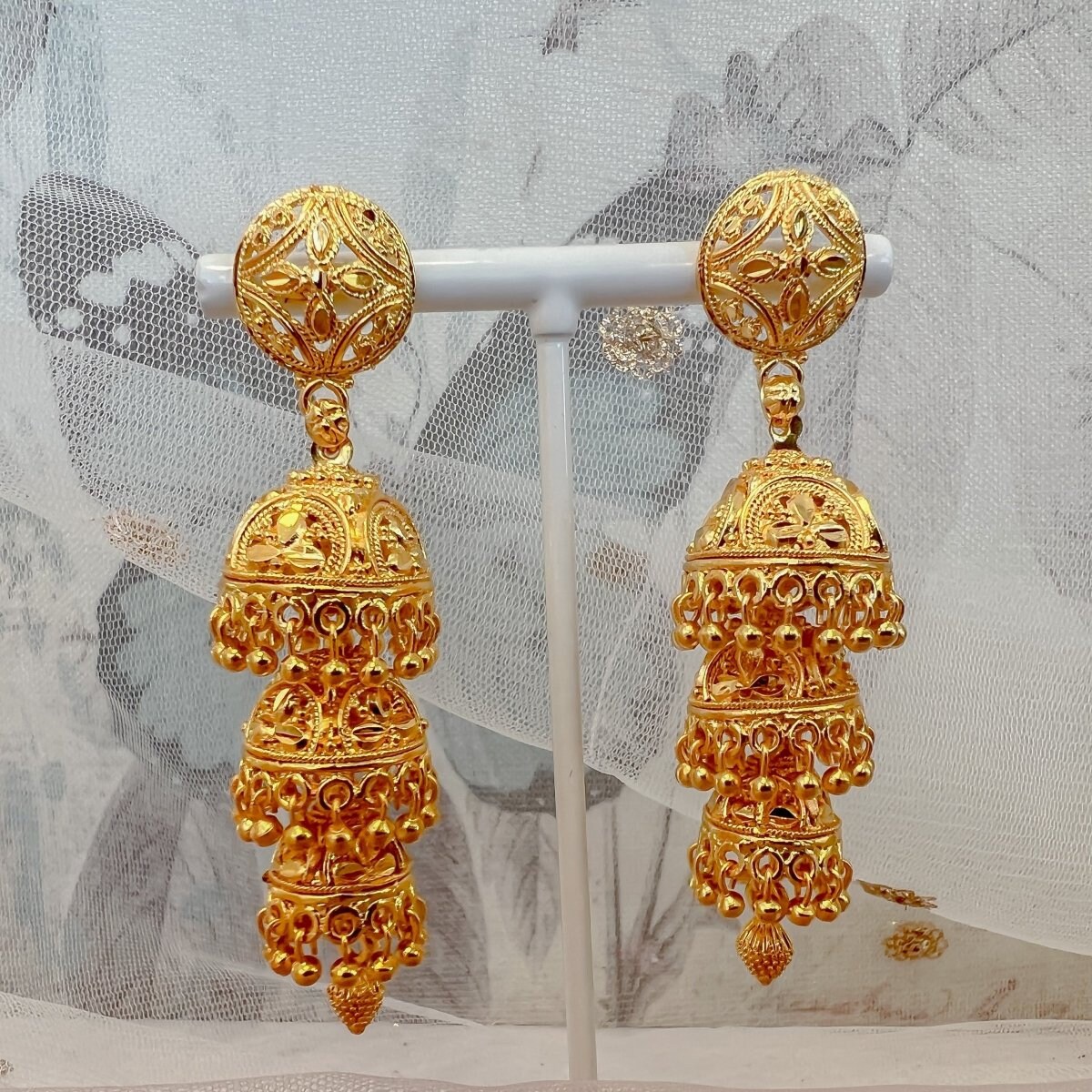 Gold covering deals jhumkas