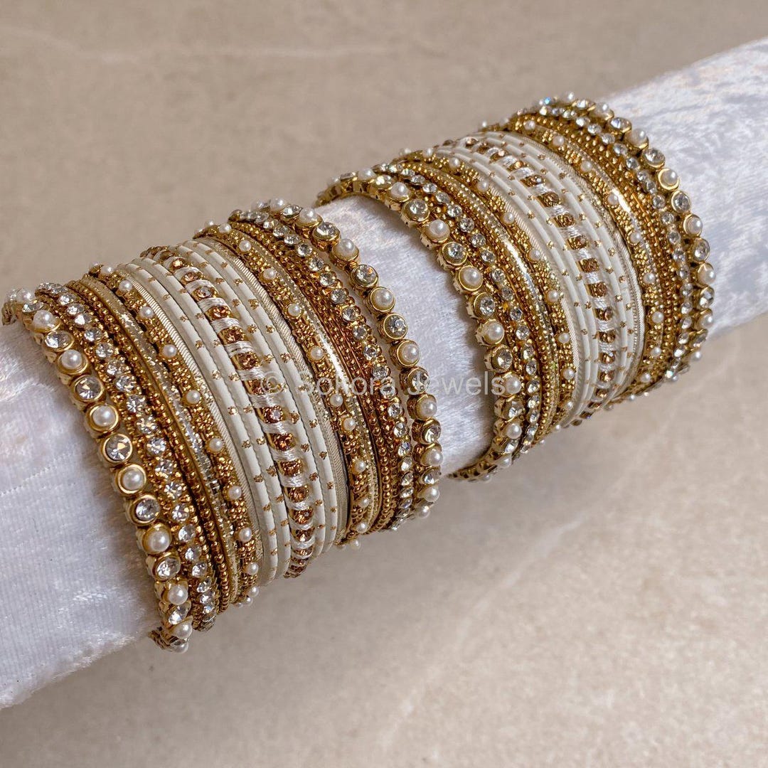 Gold and white gold bangles discount