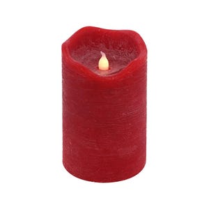 May include: A red pillar candle with a flickering LED flame. The candle has a textured surface and is ideal for adding a warm glow to any room.