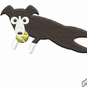 May include: A black and white dog jumps over a red and silver agility hurdle, holding a green tennis ball in its mouth.