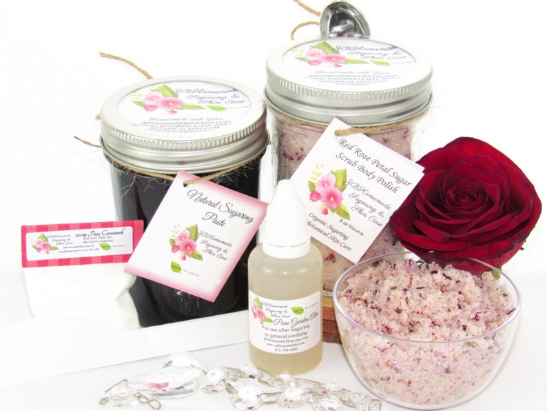 The bundle with an 8 oz jar filled with firm sugaring paste, a jar of Red Rose Petal Sugar Body Scrub, a small bottle of pure aloe vera, a pouch of cornstarch, an applicator, and a bowl showcasing the sugar scrub, garnished with a red rose bloom.