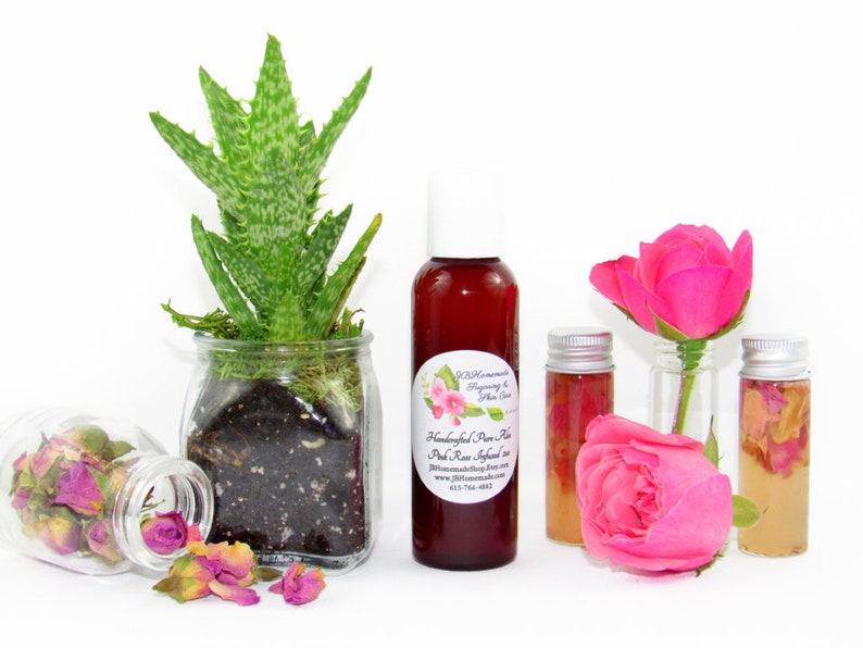 JBHomemade’s 2 oz Radiant Rose Glow: rose-infused aloe vera paired with an aloe plant. Glass jar filled with aloe and pink rose petals.