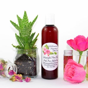 JBHomemade’s 8 oz Radiant Rose Glow: rose-infused aloe vera paired with an aloe plant. Glass jar filled with aloe and pink rose petals.