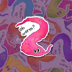 May include: A selection of stickers depicting cartoon worms in a variety of colours, each with the text "oh worm?" in a speech bubble. The worms have large, round eyes and are in shades of pink, orange, blue, and green.
