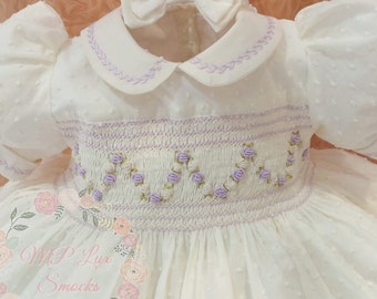 Front and back girl&#39;s smocking dress made in swiss ivory cotton dots fabric. Peter pan collar and cuffs.Bloomers and hair acc. incl