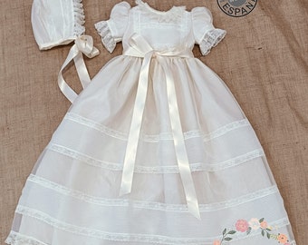 Baby Baptism gown made in ivory organza and lace. Matching bonnet included. Classic baby christening dress made in Spain.Short puffy Sleeves