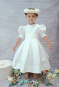 T-length Flower Girl dress classic, ivory silk with beige silk sash and big bow. Very Puffy sleeves. Under Petticoat,girl wedding dress product logo