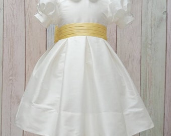 T-length Flower Girl dress classic, ivory silk with silk sash and big bow. Puffy sleeves, peter pan collar. Girl elegant wedding dress