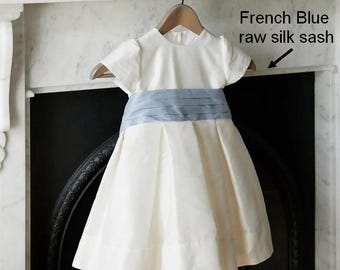T-length Flower Girl dress classic, ivory silk with ivory silk sash and big bow. Puffy straight sleeves. Under Petticoat,girl wedding dress