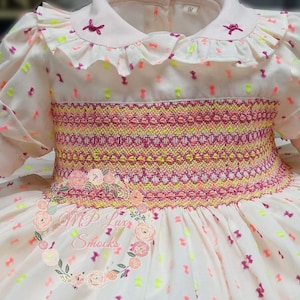 Hand-embroidered honeycomb dress, front and back, Spanish craftsmanship. Luxury smock dress. Fluorescent multicolored plumeti.