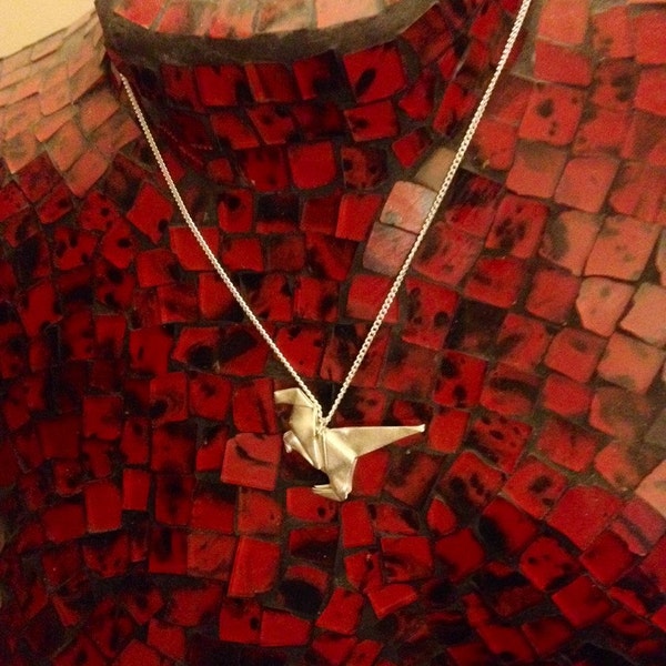 Fine silver origami dinosaur necklace.