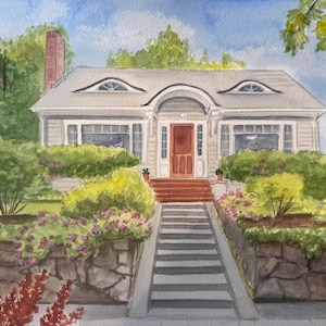 May include: Watercolor painting of a two-story house with a gray exterior, red door, and a chimney. The house has a gray roof with two oval windows. Landscaping includes bushes, flowers, and a stone wall.