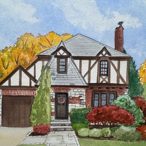 May include: Watercolor painting of a Tudor-style house with a gray roof, brick chimney, and brown trim. The house is surrounded by lush greenery and colorful autumn foliage. A garage and front door are visible.