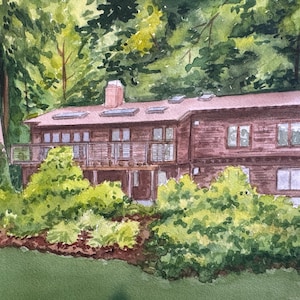 May include: Watercolor painting of a two-story brown house with a deck, surrounded by lush green trees and foliage. The house has multiple windows and a chimney. The artwork captures a serene, natural setting.