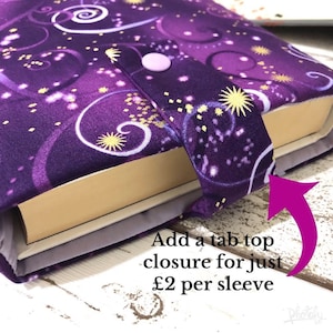 May include: A purple fabric book sleeve featuring a pattern of swirling lines and gold starbursts. The sleeve includes a fabric tab closure secured with a light purple snap button. The text on the image reads: Add a tab top closure for just &pound;2 per sleeve.