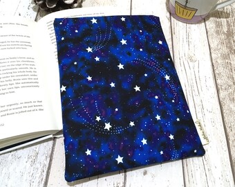 May include: A blue and black book cover with a white star pattern. The cover has a white tag with the text "Mob Make".