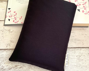 May include: A black book buddy, a soft, padded book holder, with the text "Book Buddy" printed on the bottom right corner.